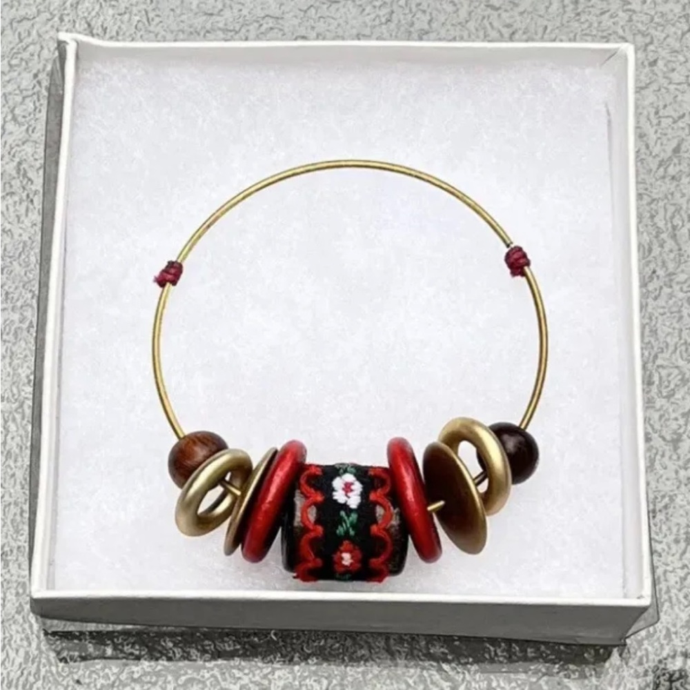 Small child bangle bracelet with center wood bead embroidered material 6.25”